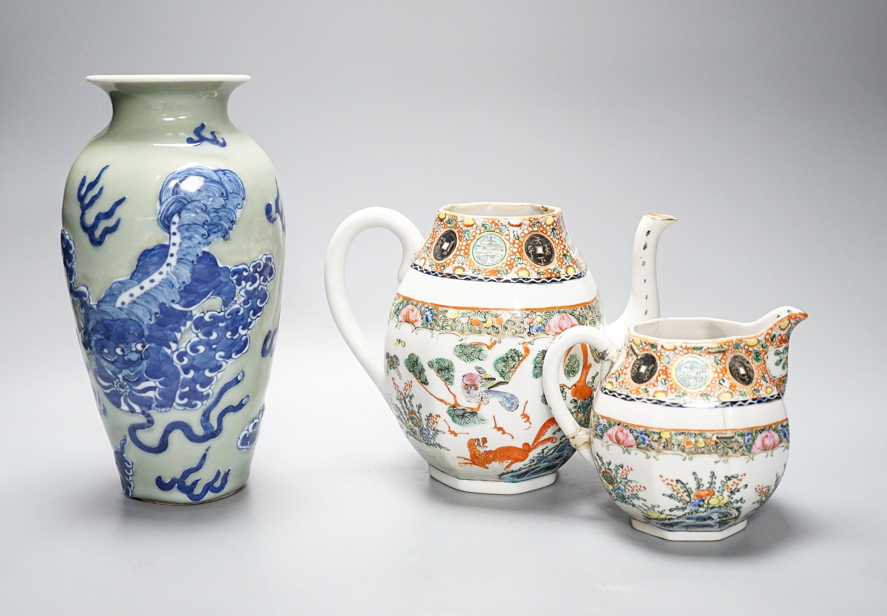 A Chinese celadon glazed vase, 24cm and a Chinese famille rose teapot and matching cream jug, a.f.